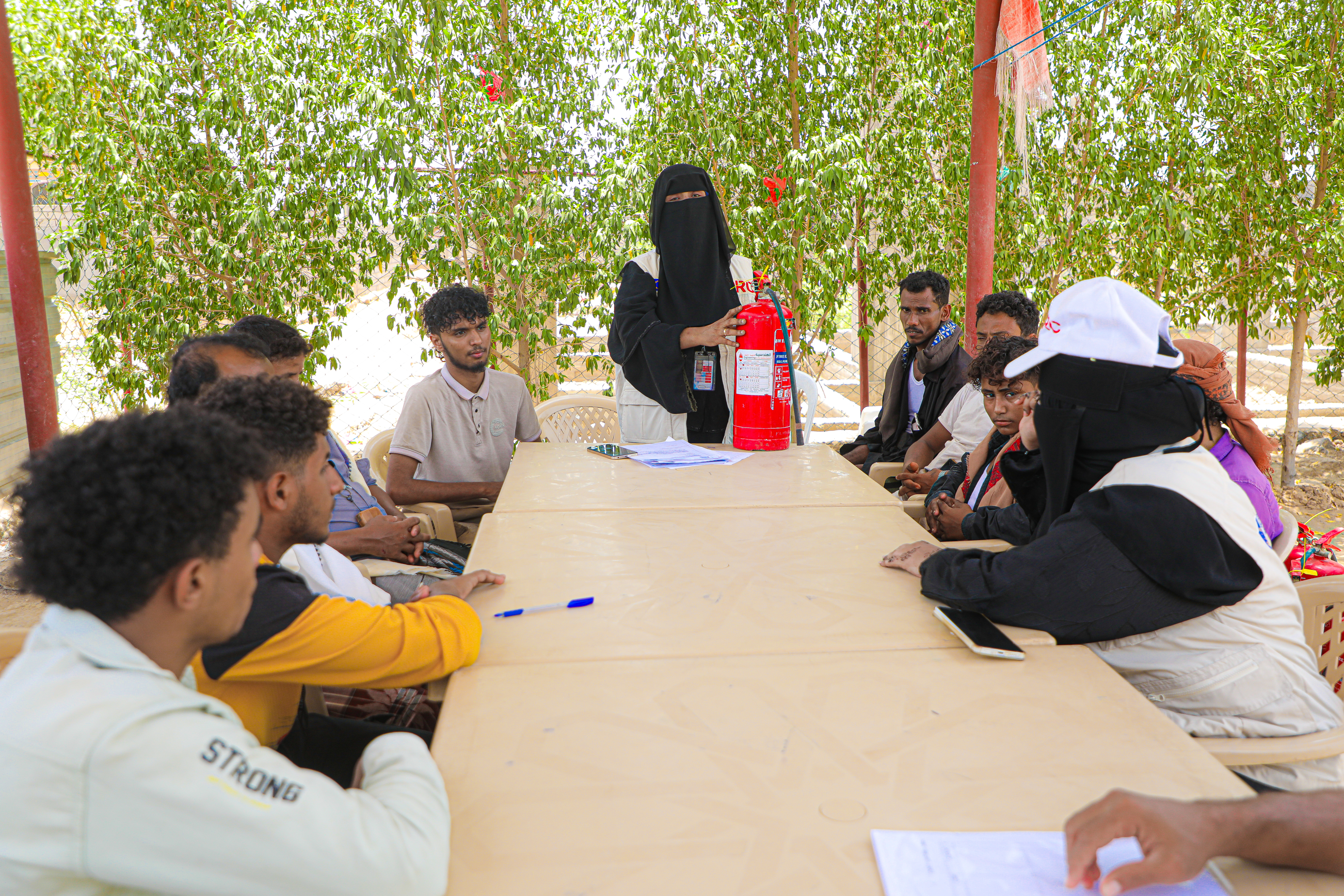 In response to community concerns about fire risks, DRC launched a fire awareness campaign in the camps. Zainab led a session with the Fire Safety Committee, explaining how to use and maintain fire extinguishers. 26 extinguishers were handed over to trained volunteers from both host and displaced communities, who now act as first responders in emergencies.