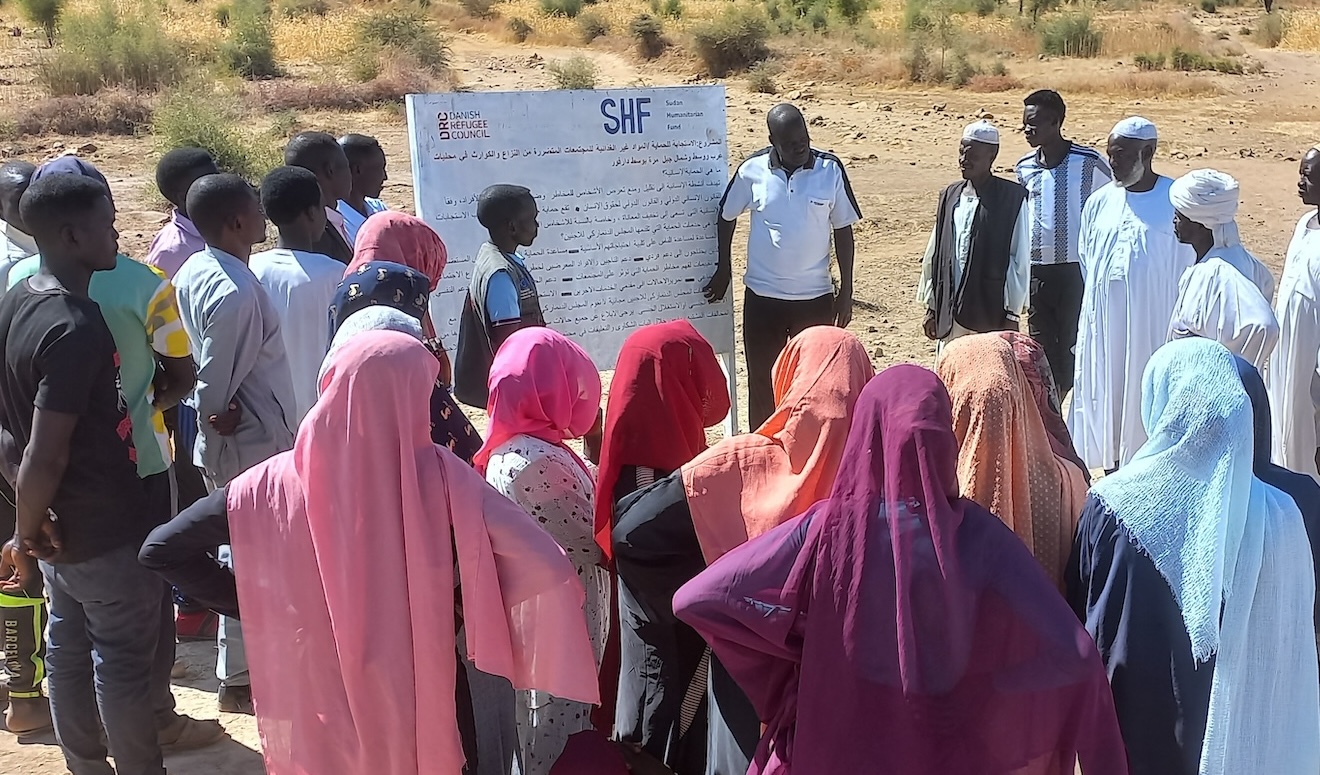 Installation of billboard in Central Darfur explaining protection programme objectivesDRC